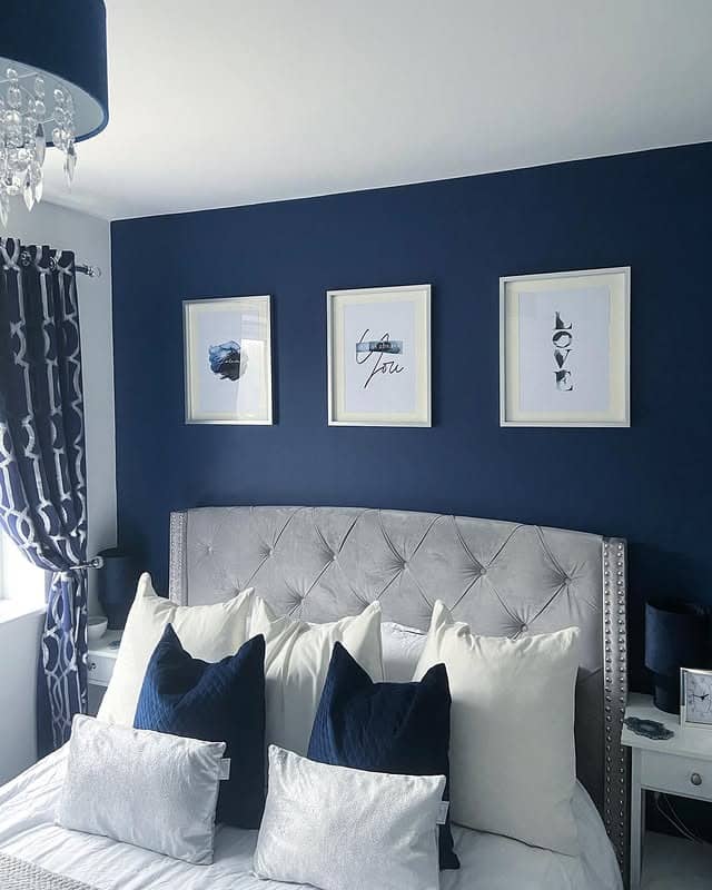 4. Navy Accent Wall with Silver and White Styling - navy bedroom ideas