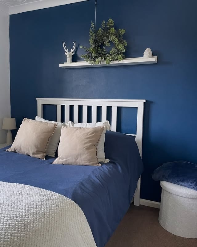 8. Classic Navy Wall with Blue and Cream Bedding - navy bedroom ideas