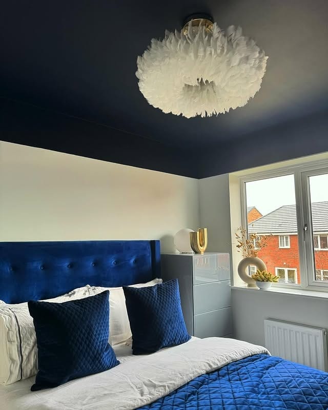 12. Navy Ceiling Bedroom with Blue Velvet Accents - navy bedroom ideas