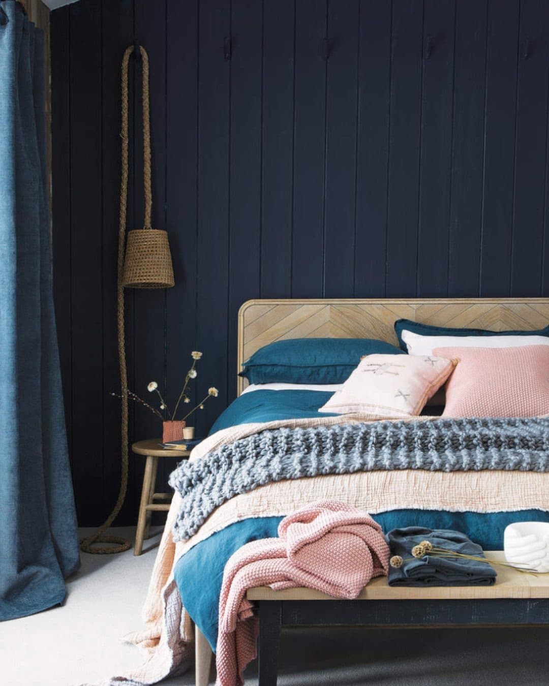 15. Navy Shiplap Bedroom with Soft Pink Accents - navy bedroom ideas