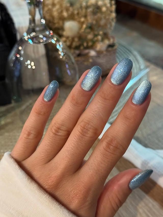 4. Shimmering Ice Blue Oval Nails - light blue nail ideas