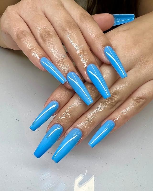 6. Light Blue and Silver Glitter Accent Almond Nails - light blue nail ideas