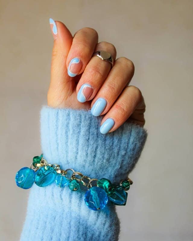 11. Abstract Light Blue Oval Nails - light blue nail ideas