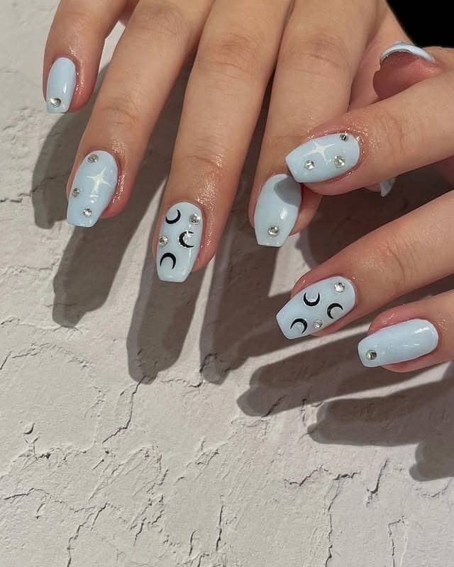 13. Celestial Light Blue Square Nails with Rhinestones - light blue nail ideas