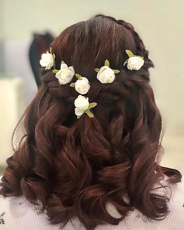 17. Rich Auburn Crown Braid Half-Up Curls with Floral Details - Crown Braid Hairstyles