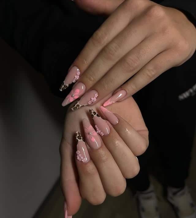 10. Pink Cow Print Floral Almond Nails - long nail ideas