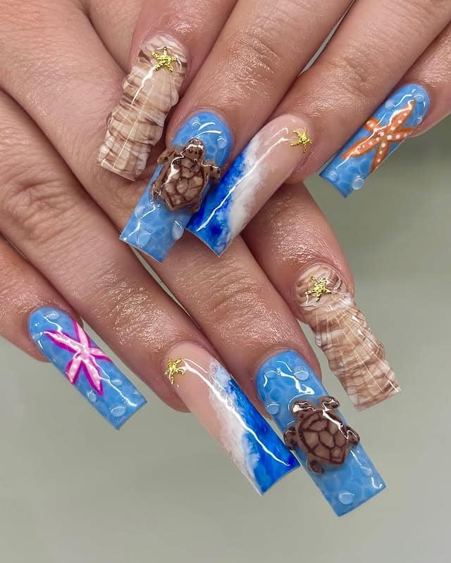 11. Ocean Blue Beach Coffin Nails - long nail ideas