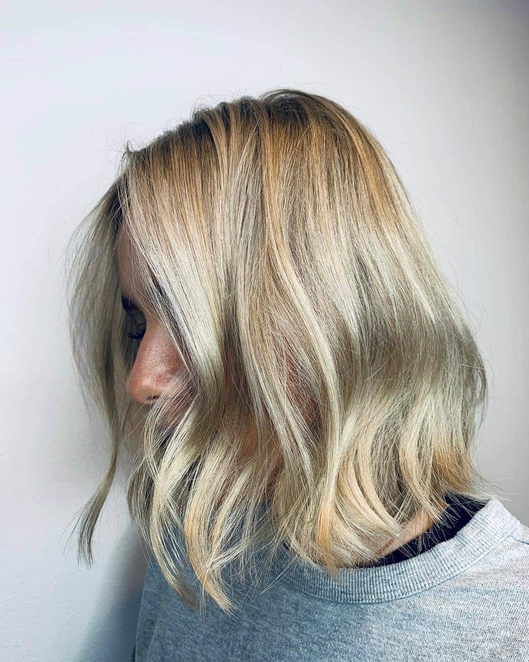 10. Bright Vanilla Blonde Wavy Midi Bob - Midi Cut Hairstyles