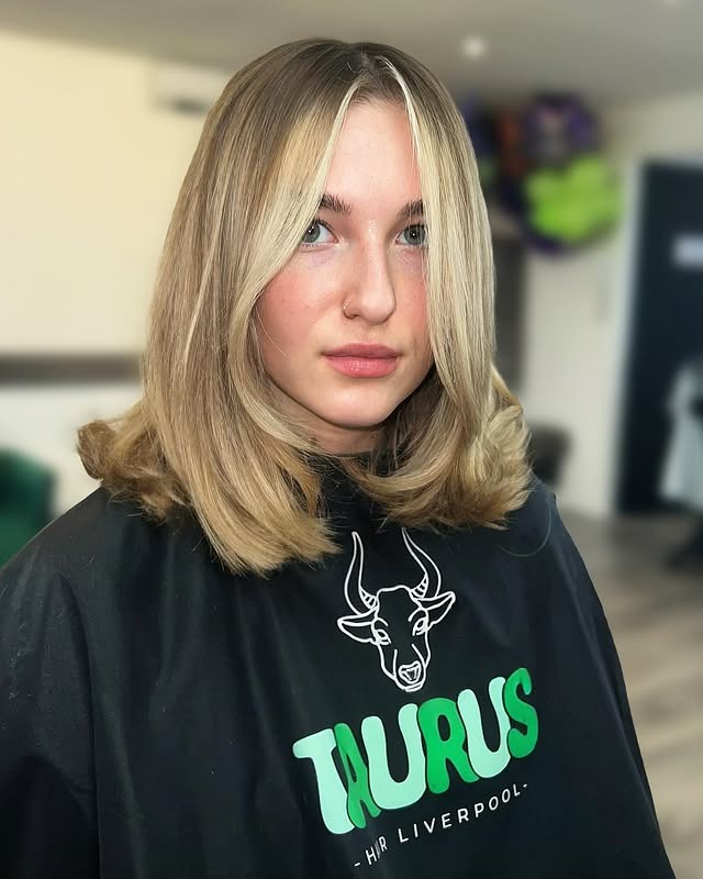 17. Face-Framing Blonde Midi Cut with Curtain Layers - Midi Cut Hairstyles