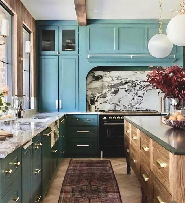 1. Jewel-Toned Teal Kitchen with Marble Statement Wall - elegant kitchen ideas
