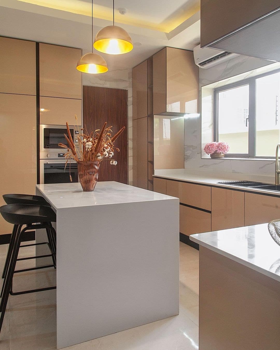 3. Warm Taupe Contemporary Kitchen with White Waterfall Island - elegant kitchen ideas