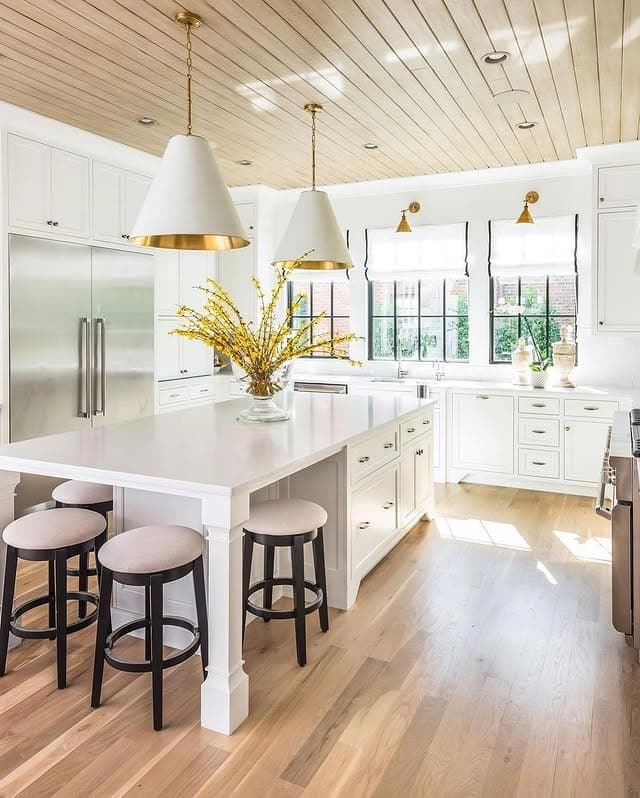 4. Bright White Kitchen with Natural Wood Ceiling Details - elegant kitchen ideas
