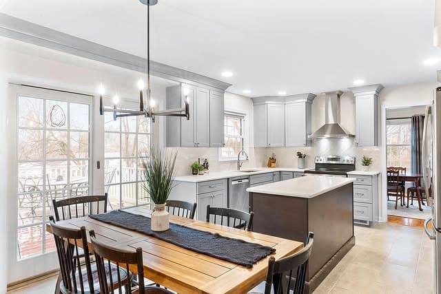 6. Soft Gray Transitional Kitchen with Dark Wood Island - elegant kitchen ideas
