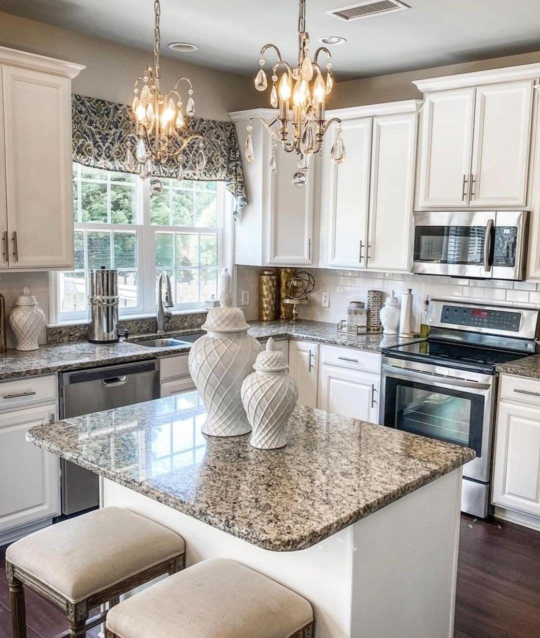 19. Traditional White Kitchen with Granite Island and Crystal Chandeliers - elegant kitchen ideas