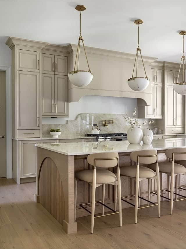 20. Soft Beige Luxury Kitchen with Arched Island Detailing - elegant kitchen ideas