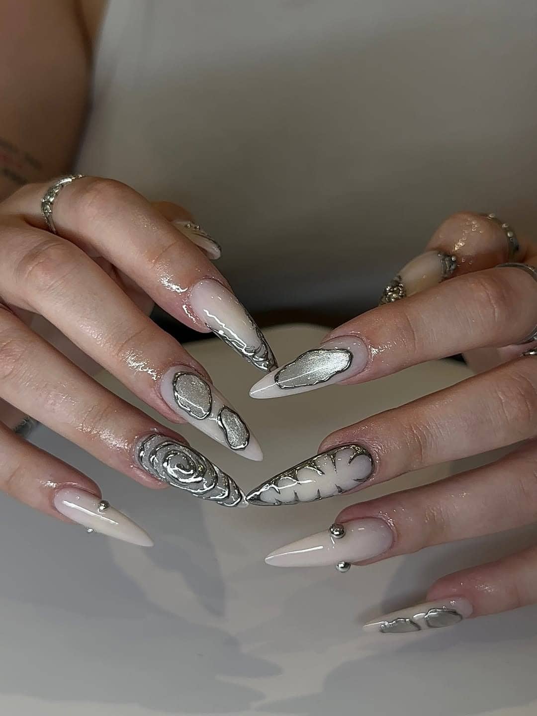 1. Silver Chrome Outline Stiletto Nails with Milky White Base - silver nail ideas