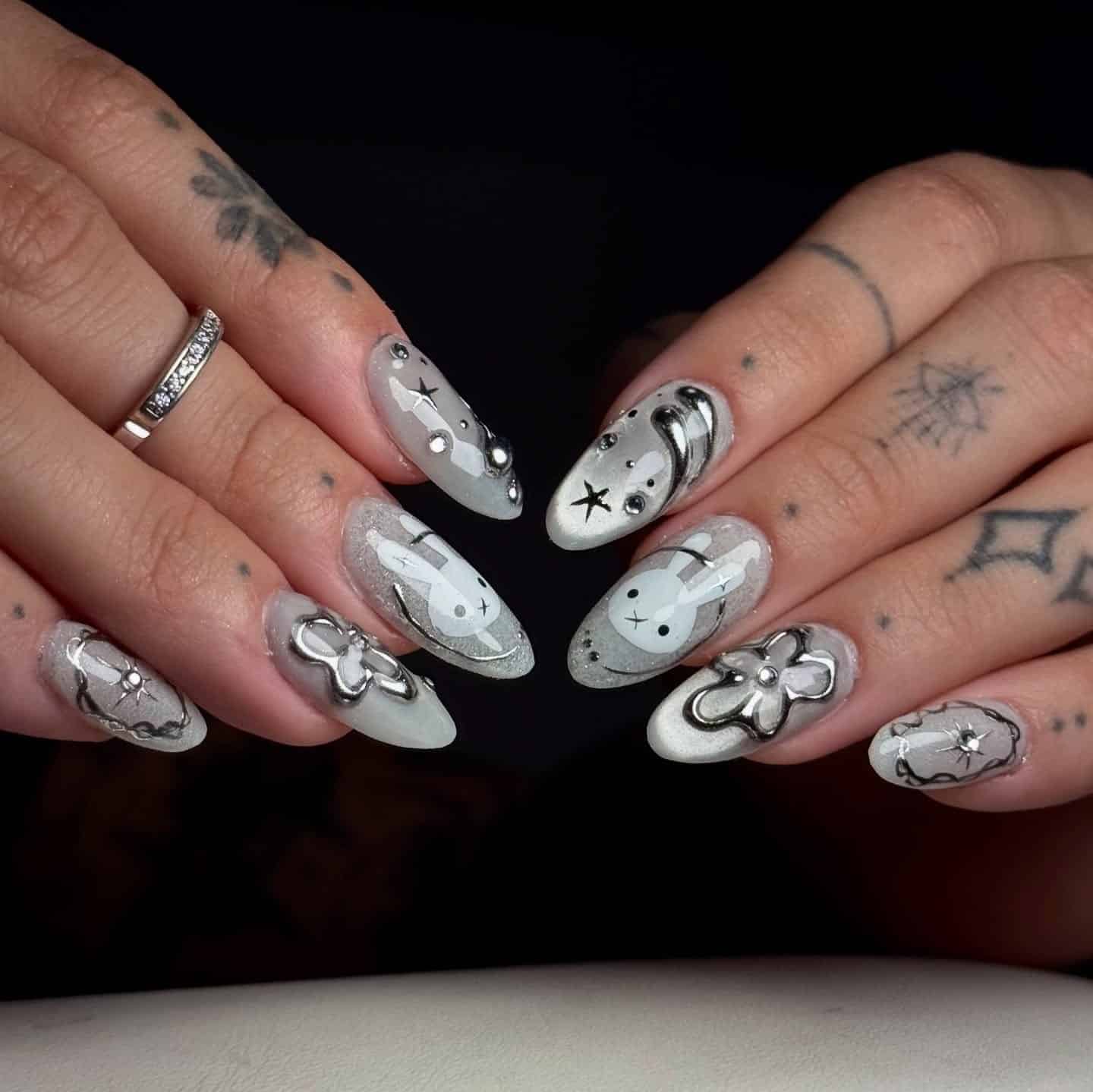 2. Silver Chrome Celestial Almond Nails with Gray Base - silver nail ideas