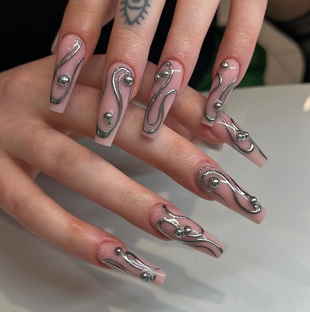 9. Nude Pink Chrome Swirl Coffin Nails with Silver Studs - silver nail ideas