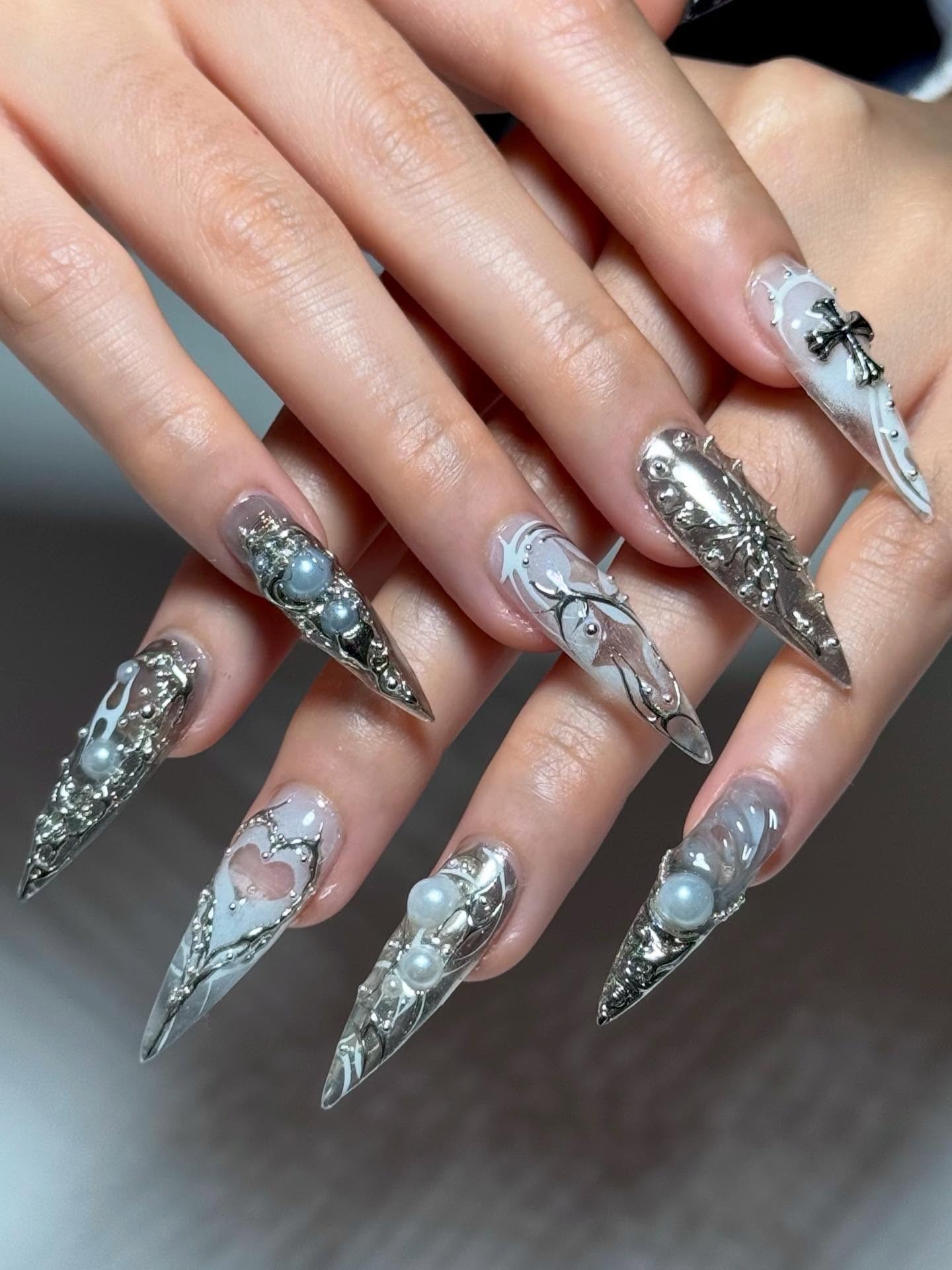 10. Silver Pearl and Chrome Stiletto Nails with 3D Details - silver nail ideas