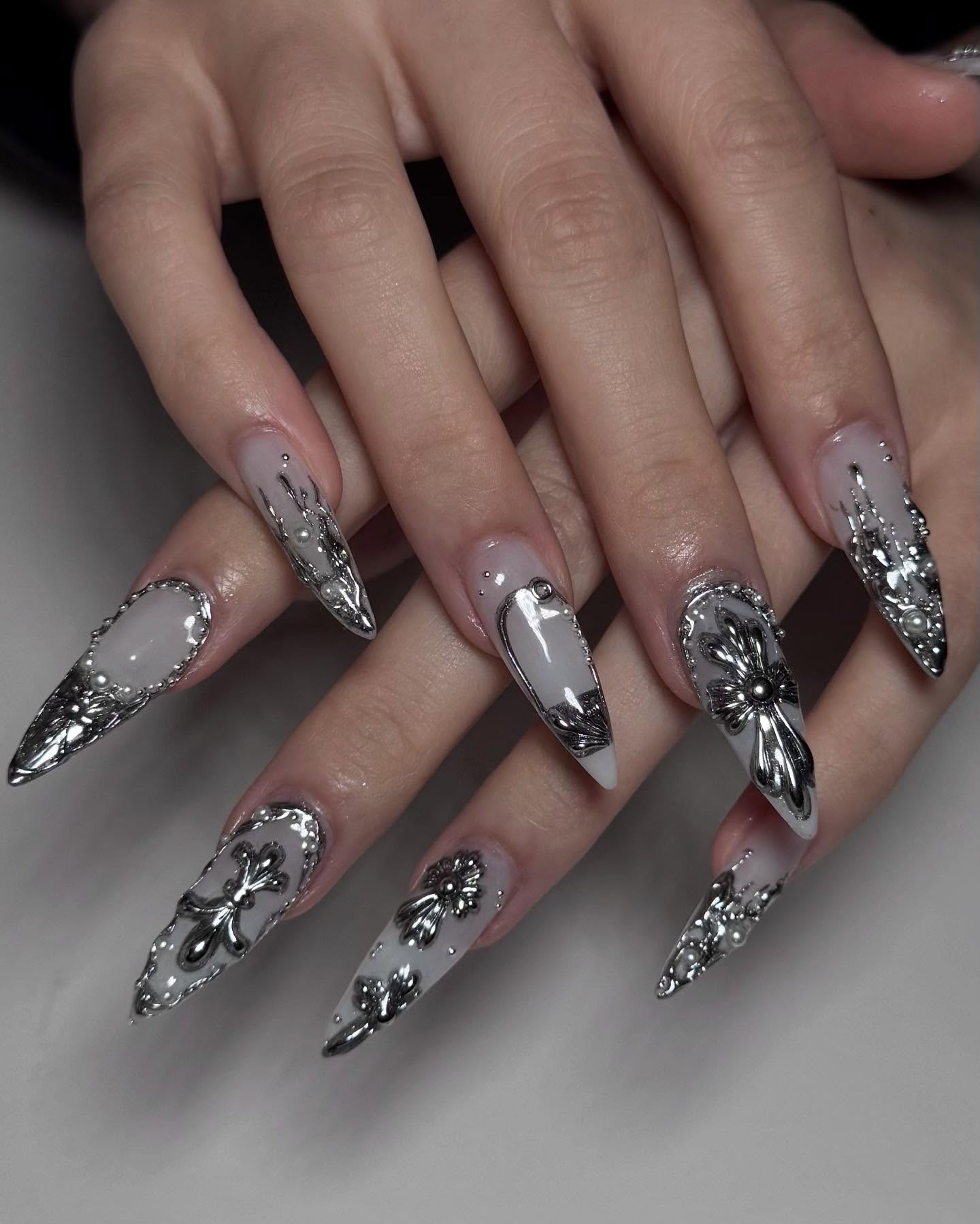 11. Silver Chrome Floral Stiletto Nails with Milky White Base - silver nail ideas