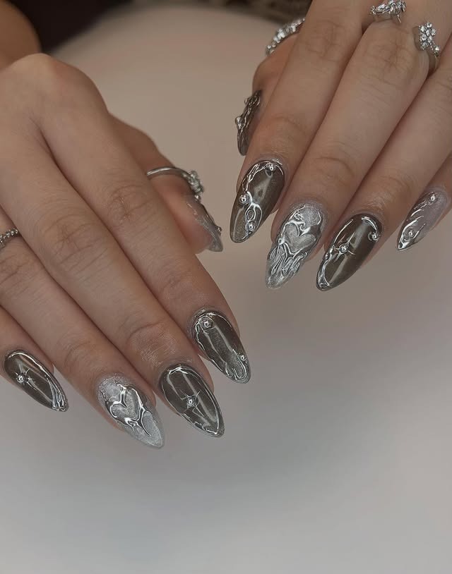 12. Gunmetal Chrome Almond Nails with Mirror Accents - silver nail ideas