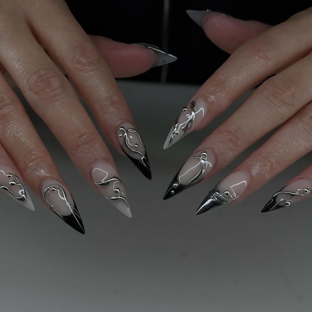 20. Black and Silver Chrome Stiletto Nails with Abstract Lines - silver nail ideas