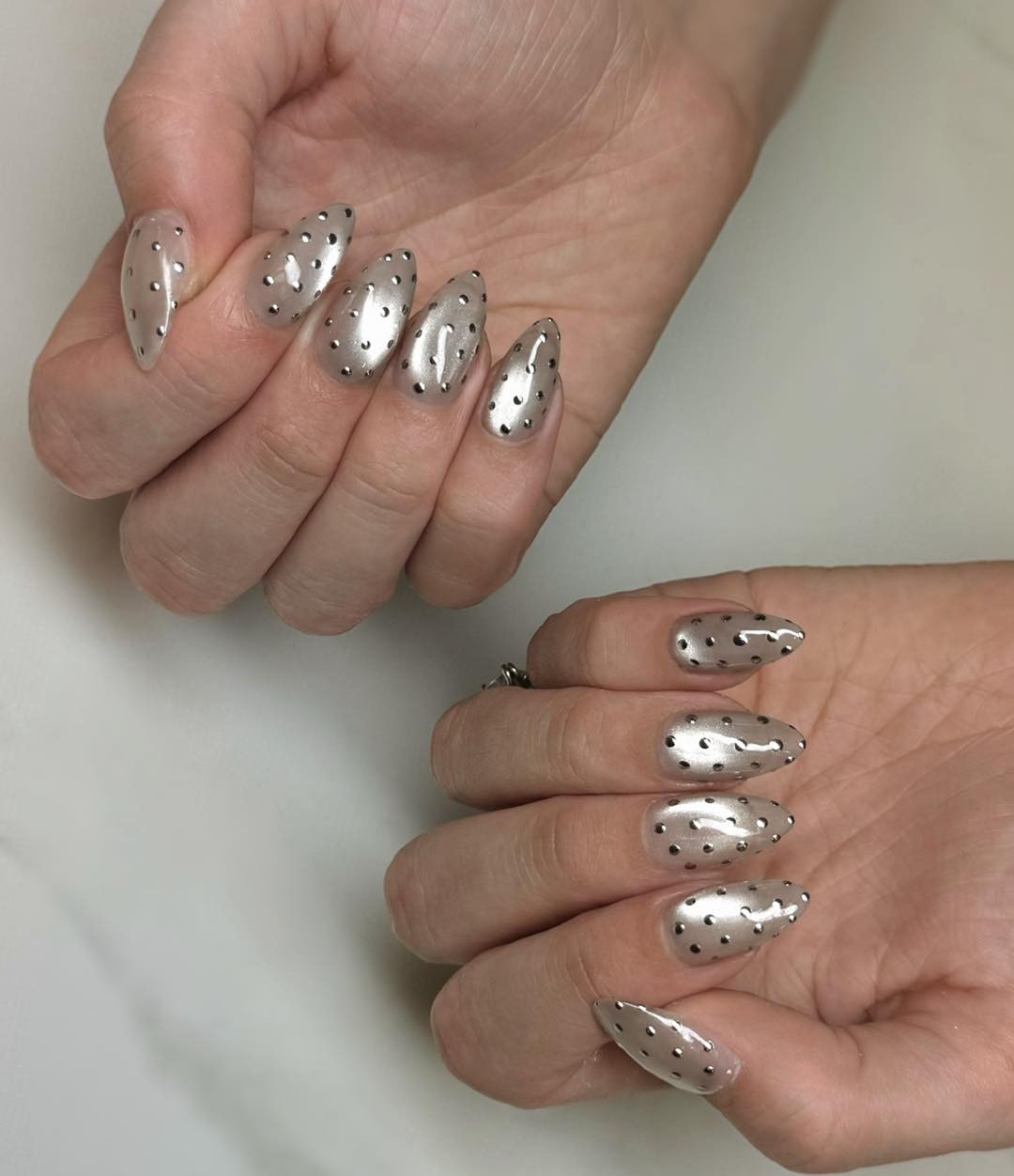 22. Metallic Silver Chrome Almond Nails with Stud Details - silver nail ideas