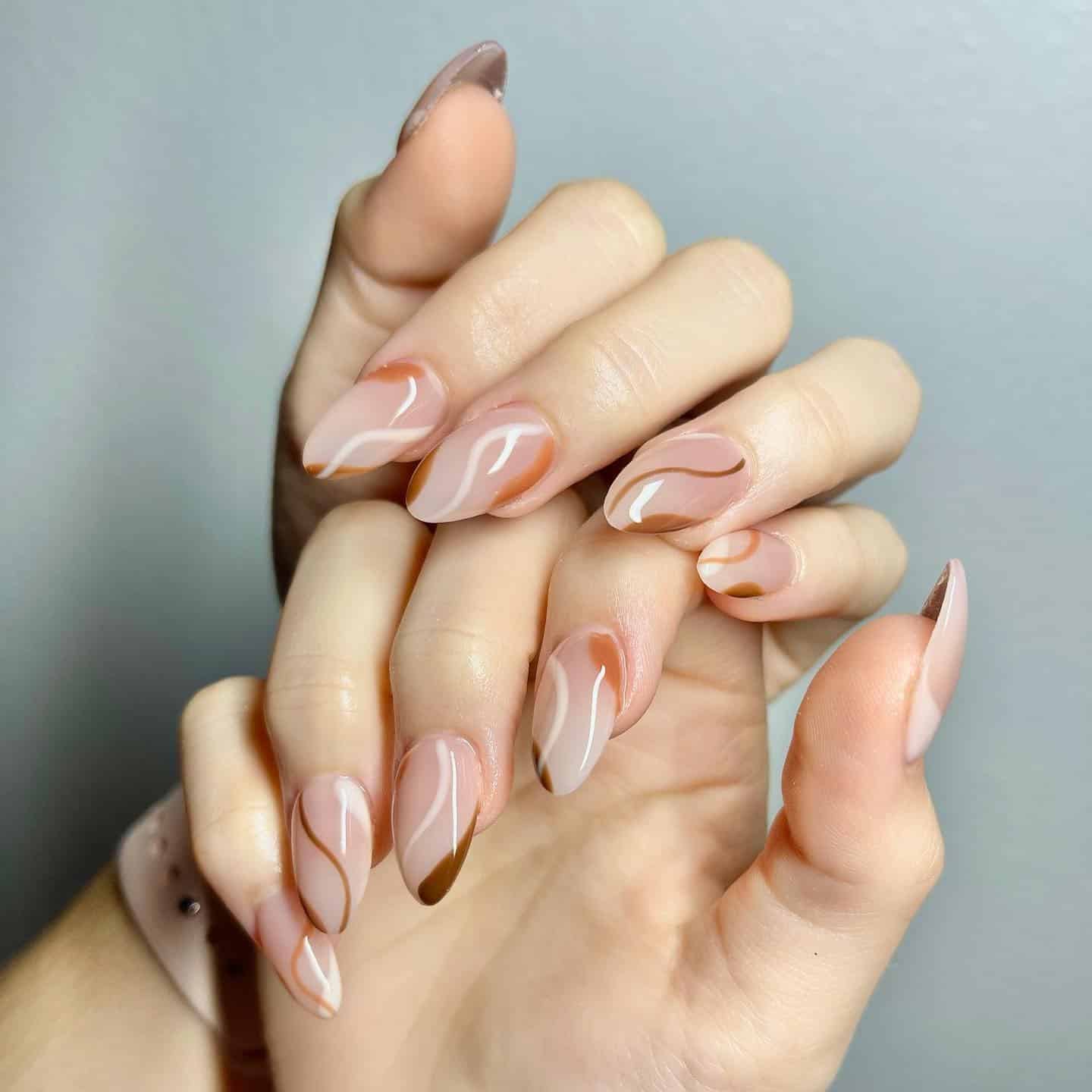 6. Abstract Brown Swirl Almond Nails - simple fall nail ideas