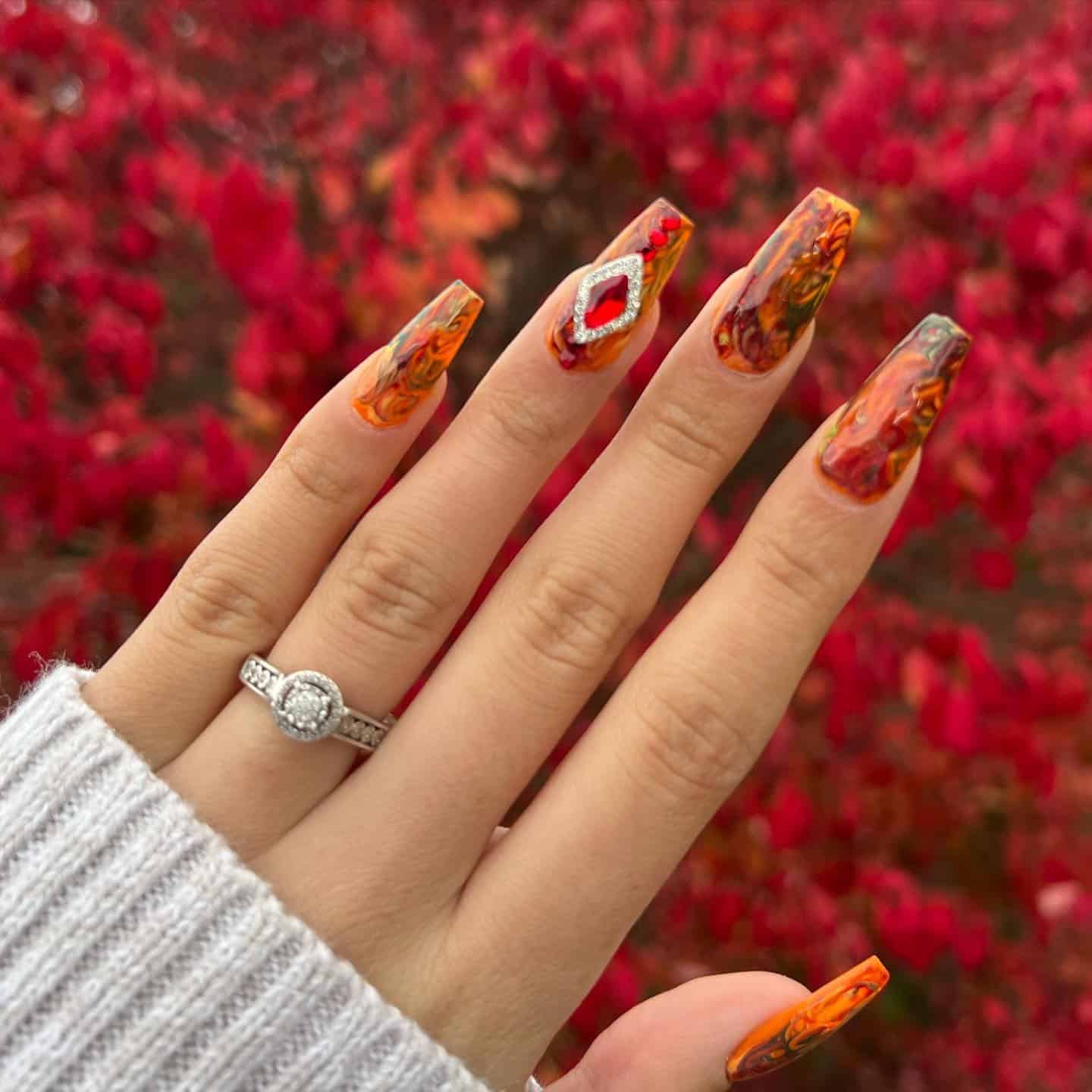 9. Autumn Marble Coffin Nails with Red Gem Accent - simple fall nail ideas