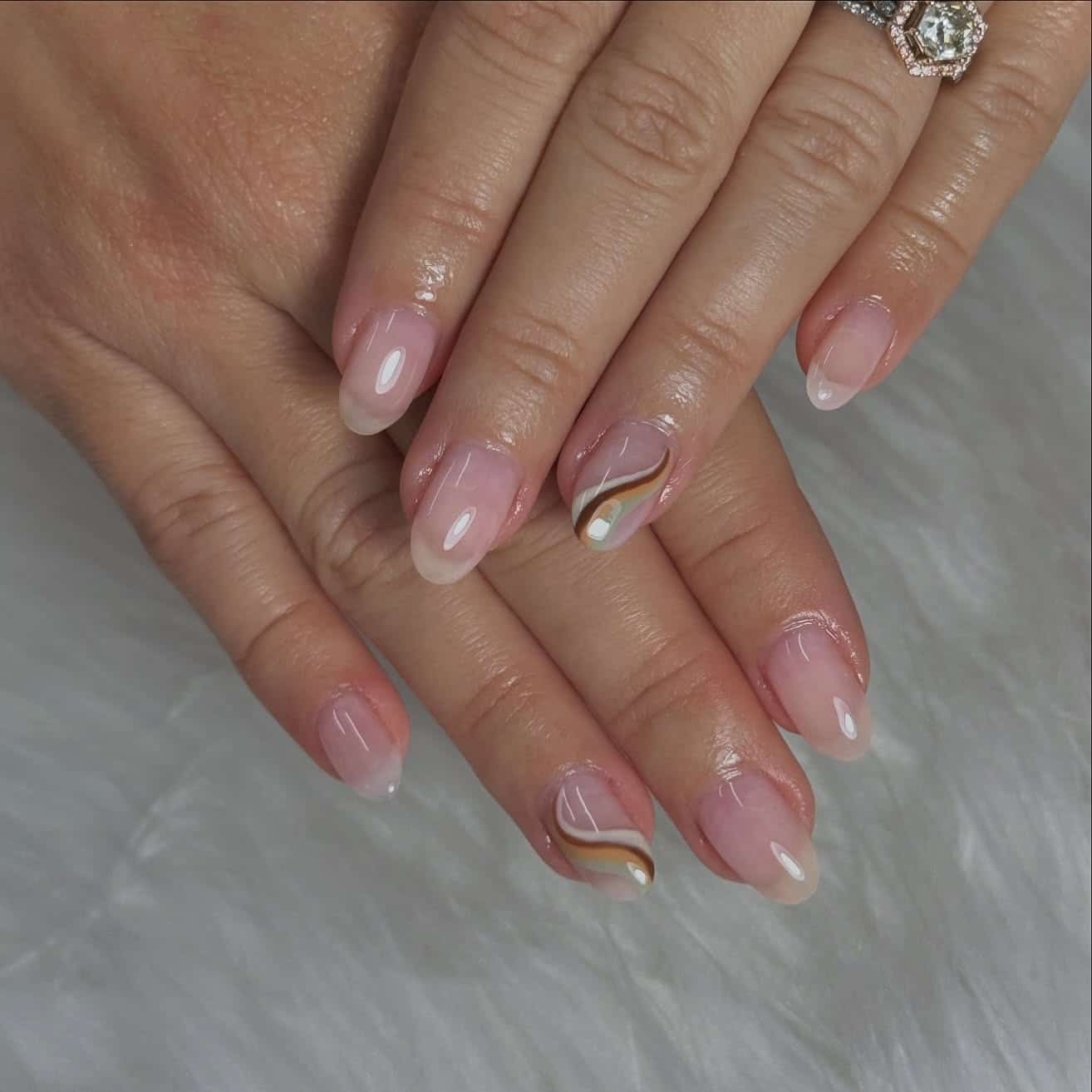 10. Minimal Neutral Swirl Short Almond Nails - simple fall nail ideas