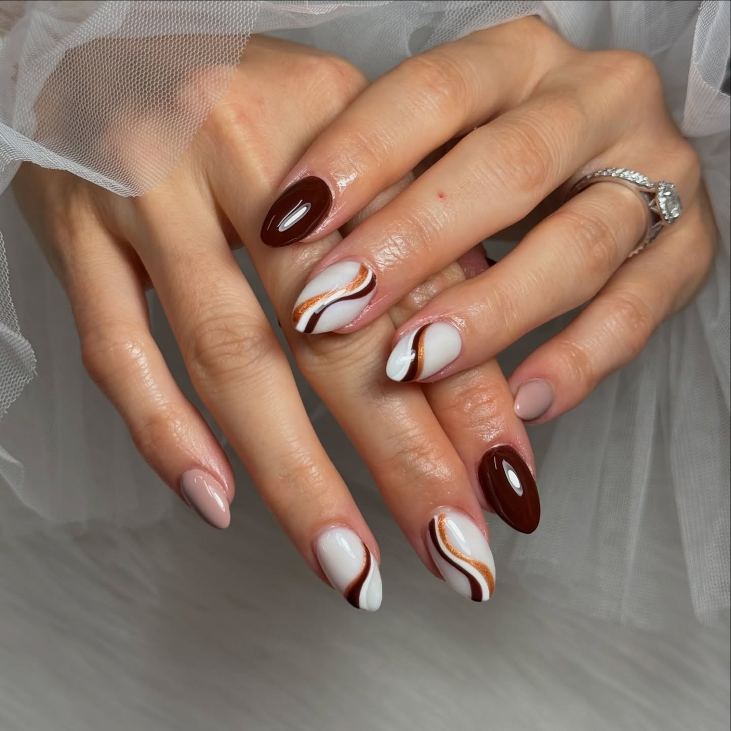 14. Chocolate Brown and White Swirl Almond Nails - simple fall nail ideas