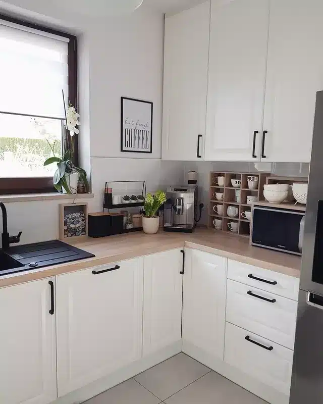 10. Modern White Corner Kitchen with Black Fixtures - simple kitchen ideas