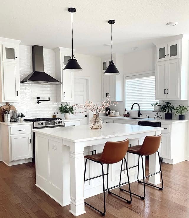 18. Bright White Kitchen with Black Lighting and Leather Seating - simple kitchen ideas