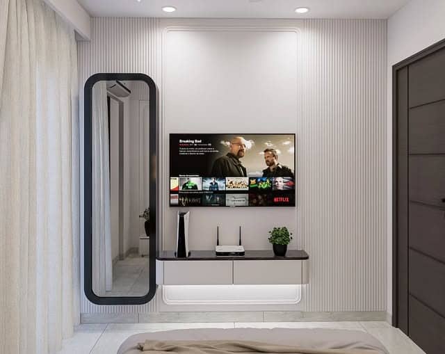 3. Bright White TV Wall with Vertical Panel Detailing - tv in bedroom ideas