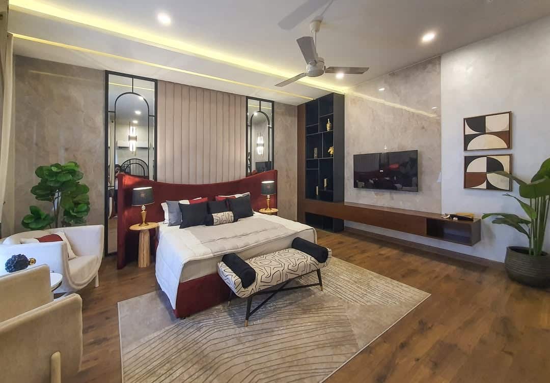 8. Luxury Marble TV Wall with Black Display Shelves - tv in bedroom ideas