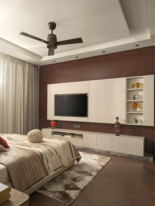 13. Chocolate Brown TV Feature Wall with White Cabinetry - tv in bedroom ideas