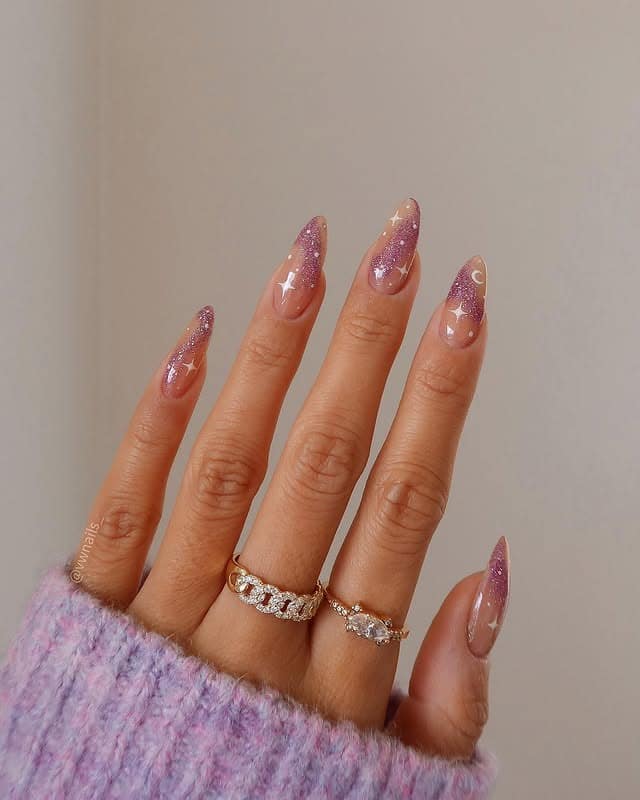 2. Pink Glitter French Almond Nails with Celestial Accents - sparkly nail ideas