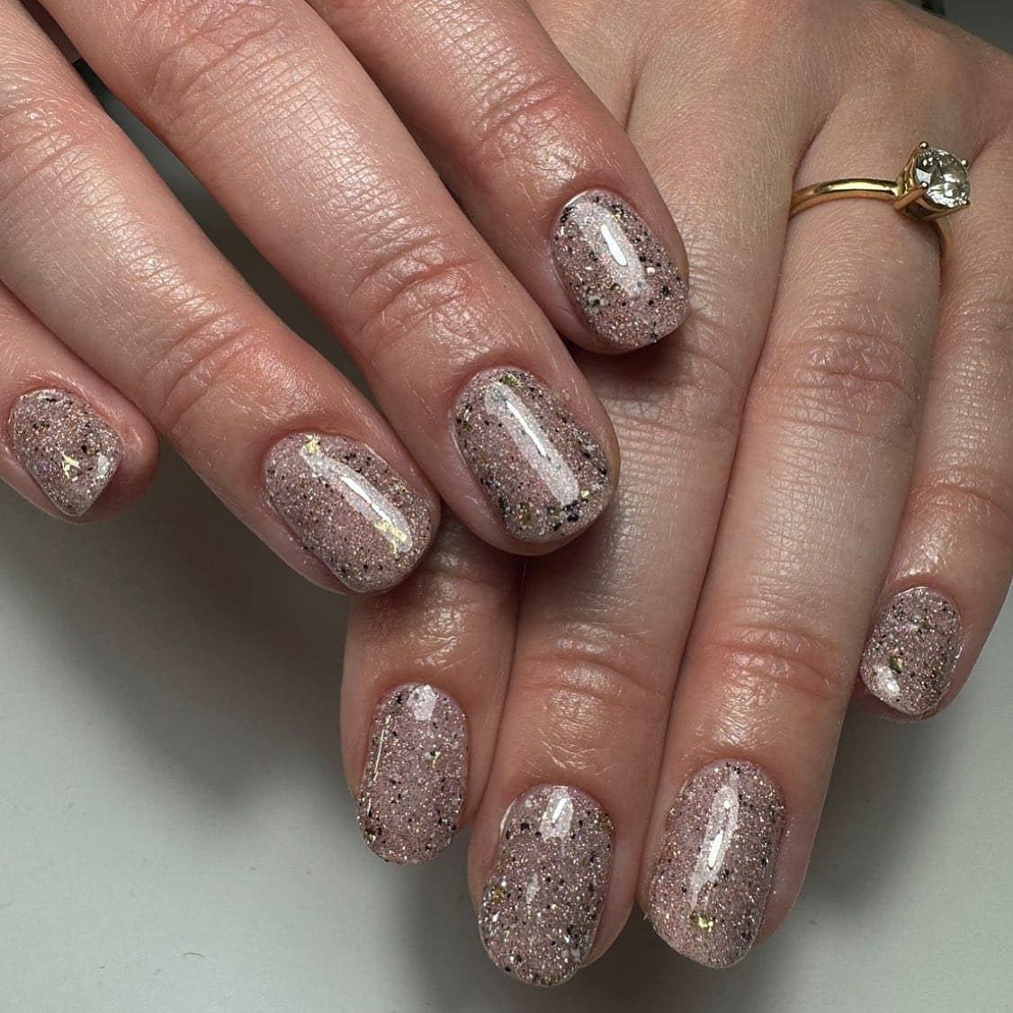 16. Blush Pink Glitter Speckled Short Nails - sparkly nail ideas