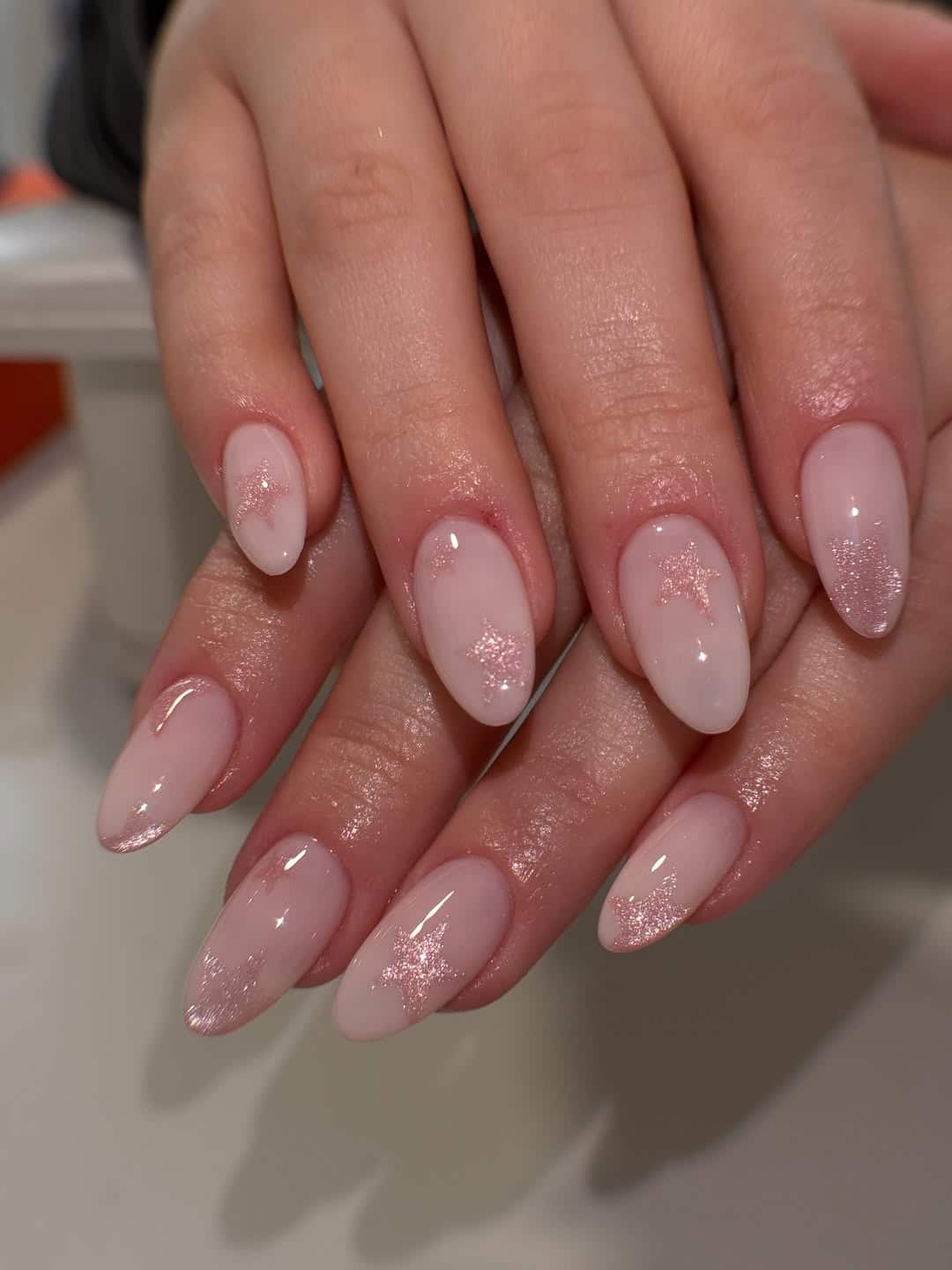 21. Blush Pink Glitter Star Almond Nails - sparkly nail ideas