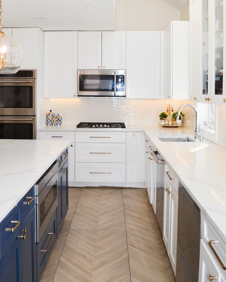 1. Classic White Shaker Kitchen with Navy Blue Island Cabinets - light color kitchen ideas