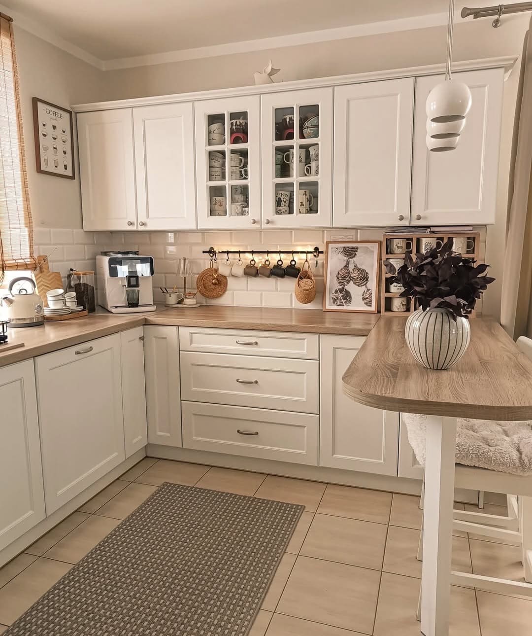 22. Classic White Shaker Kitchen with Light Wood Countertops - light color kitchen ideas