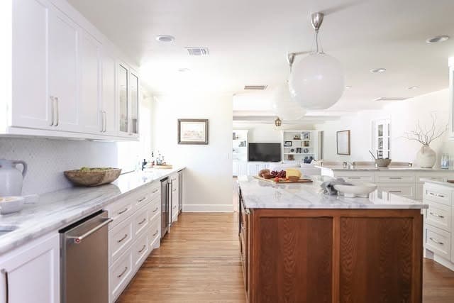 6. White Kitchen with Rich Wood Island Ideas - narrow kitchen ideas
