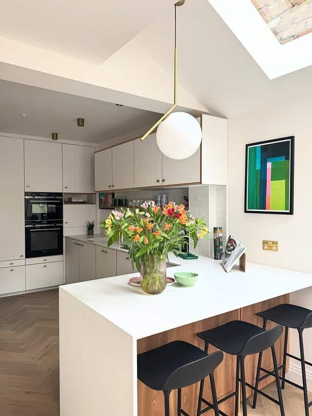 8. Cream and Walnut Narrow Kitchen with Breakfast Bar - narrow kitchen ideas
