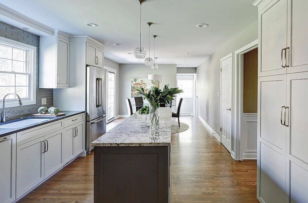 15. Light Gray and White Narrow Kitchen with Island - narrow kitchen ideas