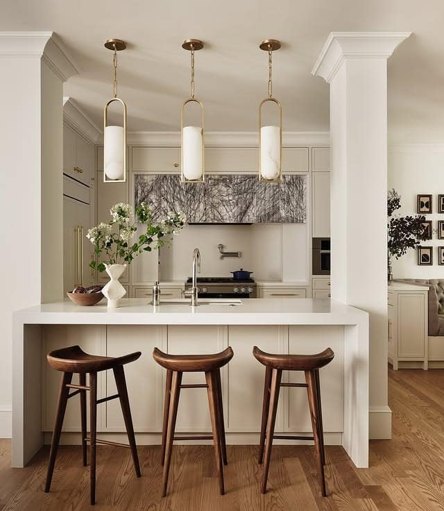 17. Cream and Walnut Narrow Kitchen with Modern Lighting - narrow kitchen ideas