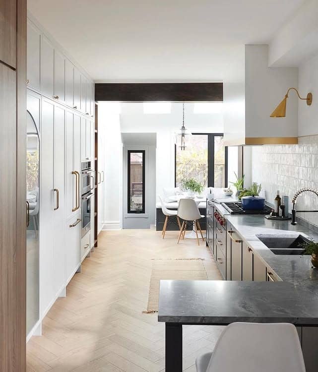 19. White and Charcoal Narrow Kitchen with Gold Accents - narrow kitchen ideas