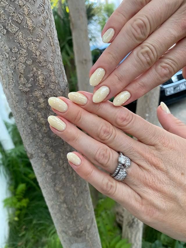 3. Glossy Cream Almond Nails - trendy simple nail ideas