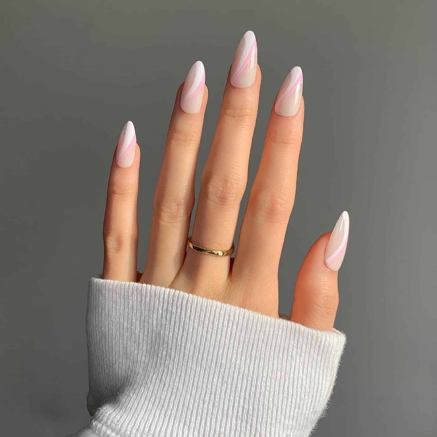 4. Milky Pink Swirl Almond Nails - trendy simple nail ideas