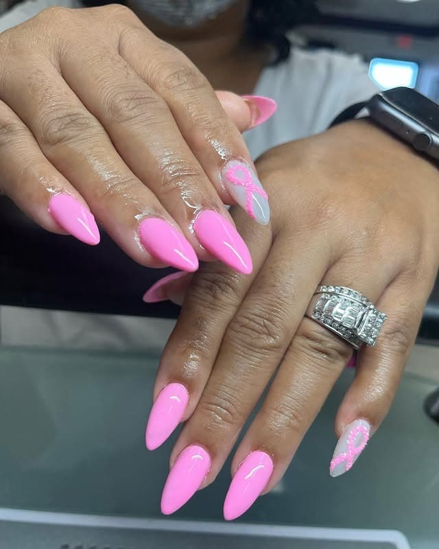 11. Bright Pink Ribbon Accent Almond Nails - trendy simple nail ideas