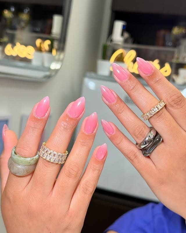 16. Glossy Candy Pink Almond Nails - trendy simple nail ideas